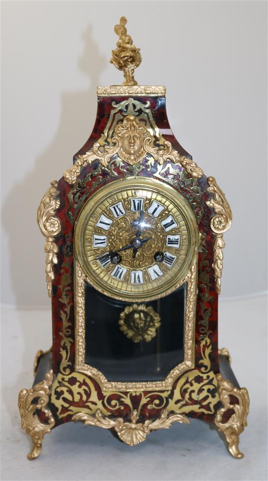 An early 20th century French red boulle mantel clock, 16in.